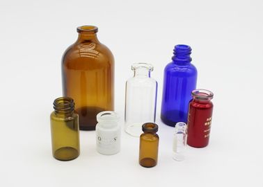 Фармацевтическая или косметическая небольшая стеклянная бутылка